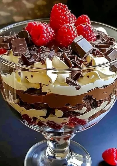 Baileys chocolate cheesecake trifle dessert in a glass with rich layers.