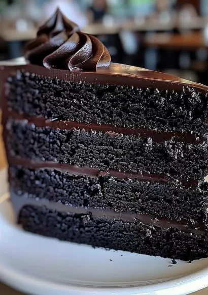 Delicious slice of Black Velvet Cake with creamy frosting.