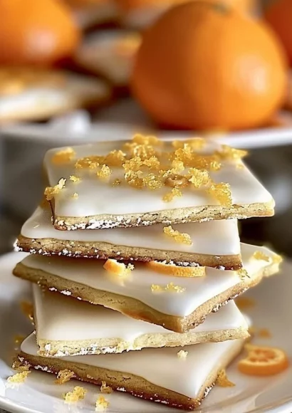 Delicious cardamom shortbread cookies topped with orange glaze