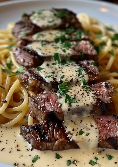 Delicious Steak Gorgonzola Alfredo served at Olive Garden with creamy sauce and sautéed steak.
