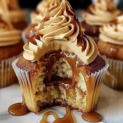Delicious salted caramel cupcakes topped with caramel drizzle and sea salt