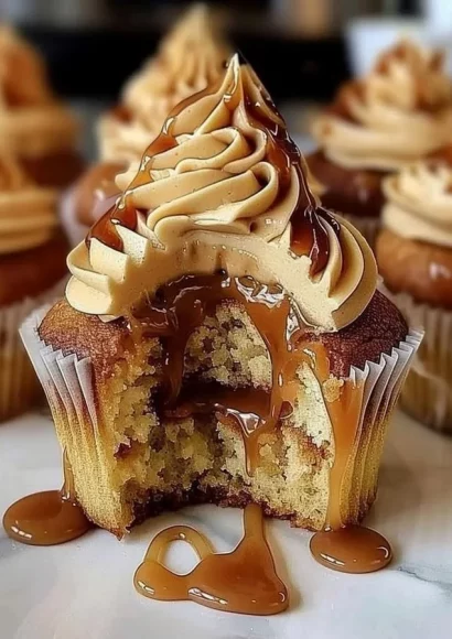 Delicious salted caramel cupcakes topped with caramel drizzle and sea salt