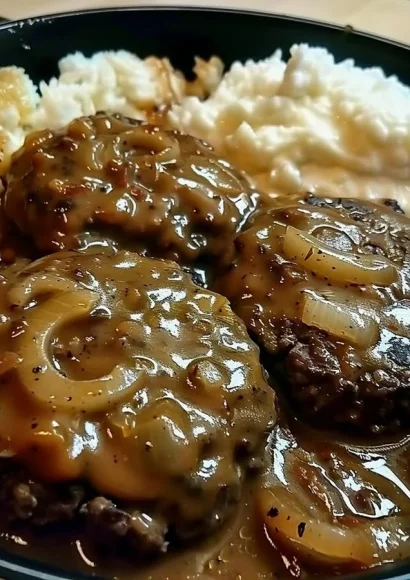 Delicious smothered hamburger steak with rich gravy served on a plate