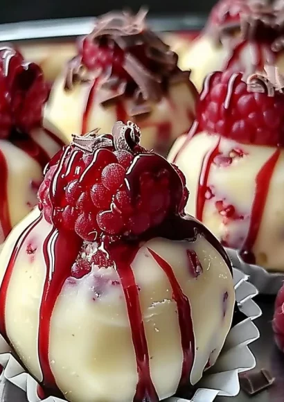 Delicious white chocolate raspberry cheesecake balls on a plate